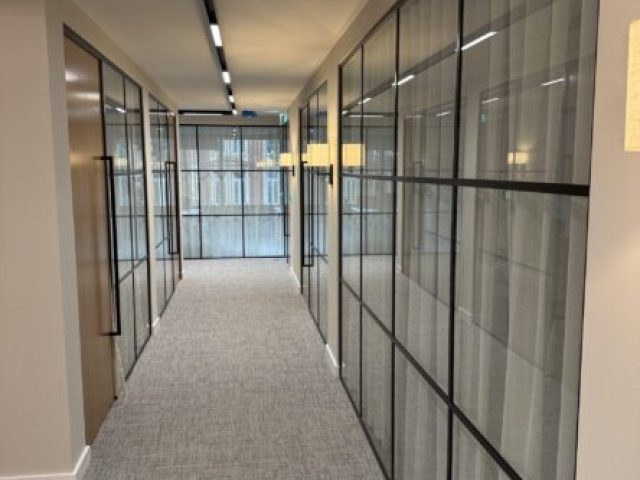 A corridor using a Glass Partition system.